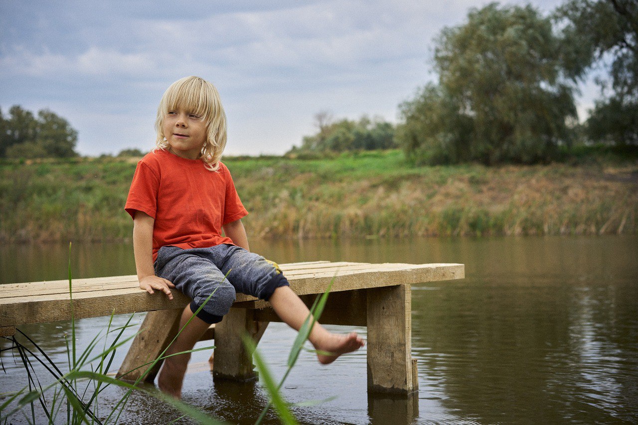A kid near the pond
